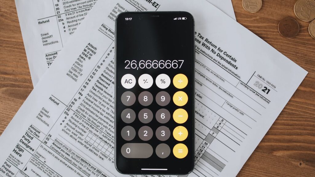 What a Working Demand Letter Looks Like — Kyrgyz Edition (Sample + Walkthrough) Official forms with calculator on a wooden desk — walkthrough of a working Kyrgyz demand letter