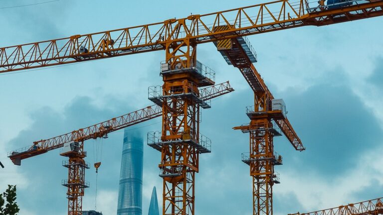 Asian skyline with construction cranes — South Asian recruitment agencies adding Kyrgyzstan to their destination mix