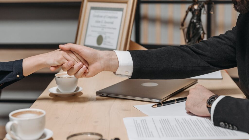 How Split-Placement Works with a Kyrgyz Checkpoint Partner: Commercial Terms Explained Business handshake over contract — split-placement commercial terms with a Kyrgyz checkpoint partner